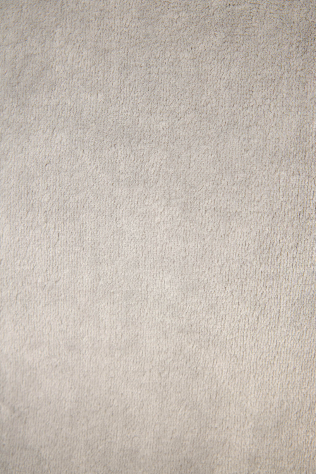 A close-up of the Luxe Plush Solid Frost Gray Robe by P.J. Salvage showcases its soft, light gray textured fabric with gentle shading and a slightly uneven, cozy surface.