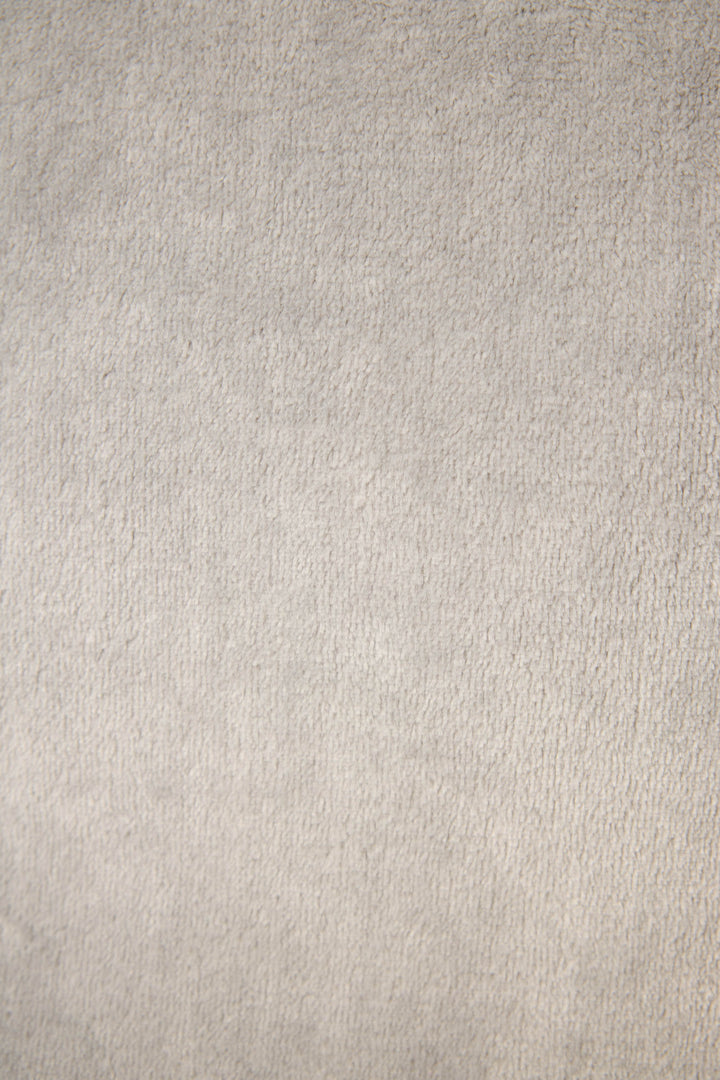 A close-up of the Luxe Plush Solid Frost Gray Robe by P.J. Salvage showcases its soft, light gray textured fabric with gentle shading and a slightly uneven, cozy surface.