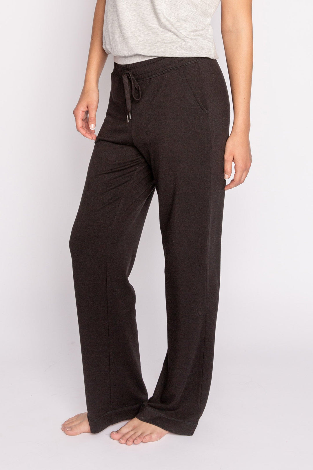 Black mini terry pajama pants with side slit, tie waistband, and pockets. (7122608324708)