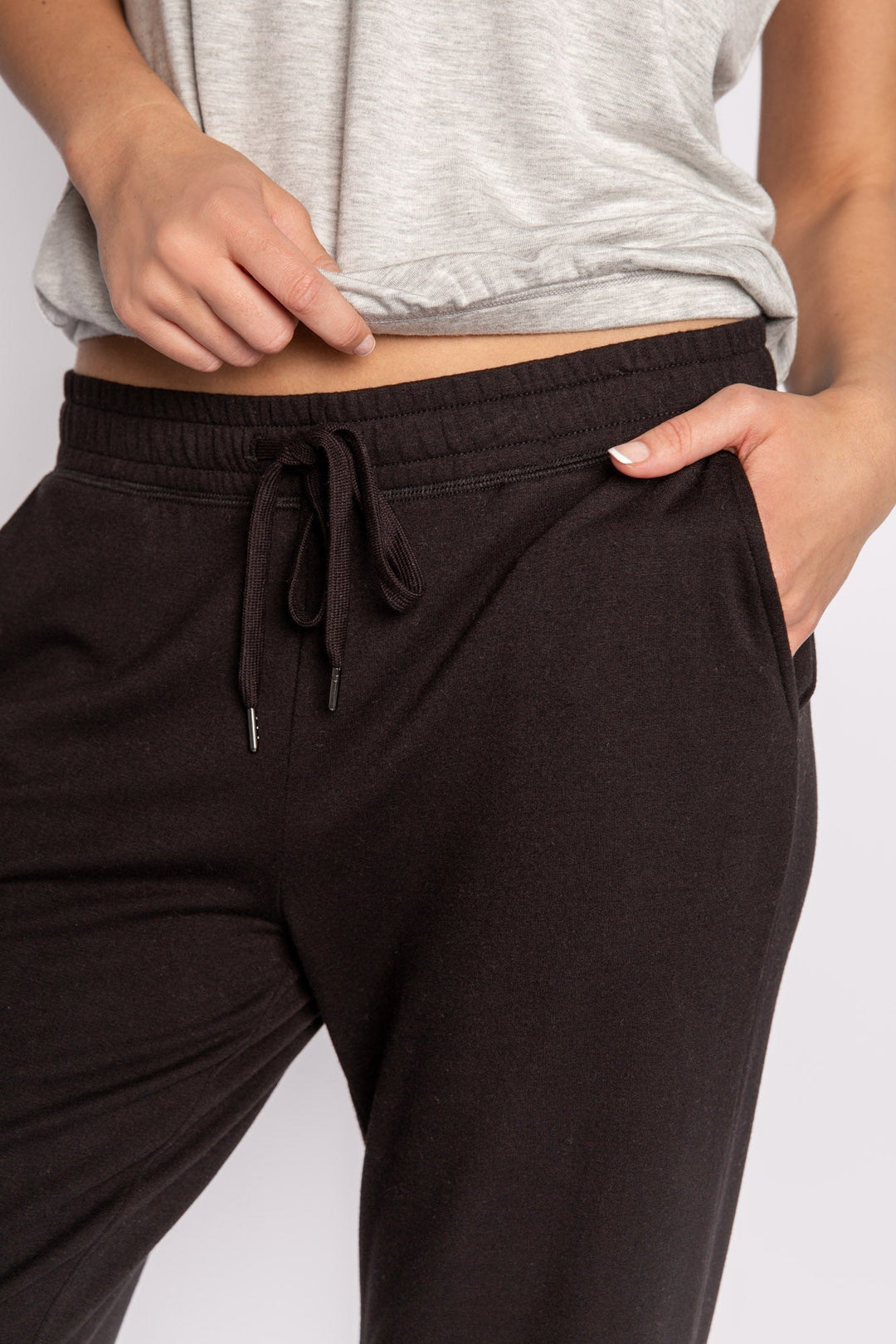 Black mini terry pajama pants with side slit, tie waistband, and pockets. (7122608324708)