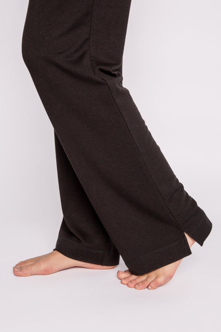 Black mini terry pajama pants with side slit, tie waistband, and pockets. (7122608324708)