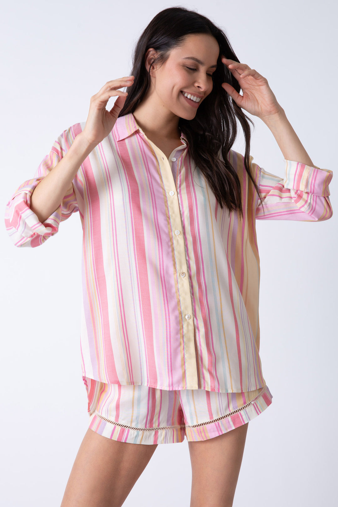 Women's striped button down shirt in pink-peach-natural. Collar & roll-up tab sleeve.
