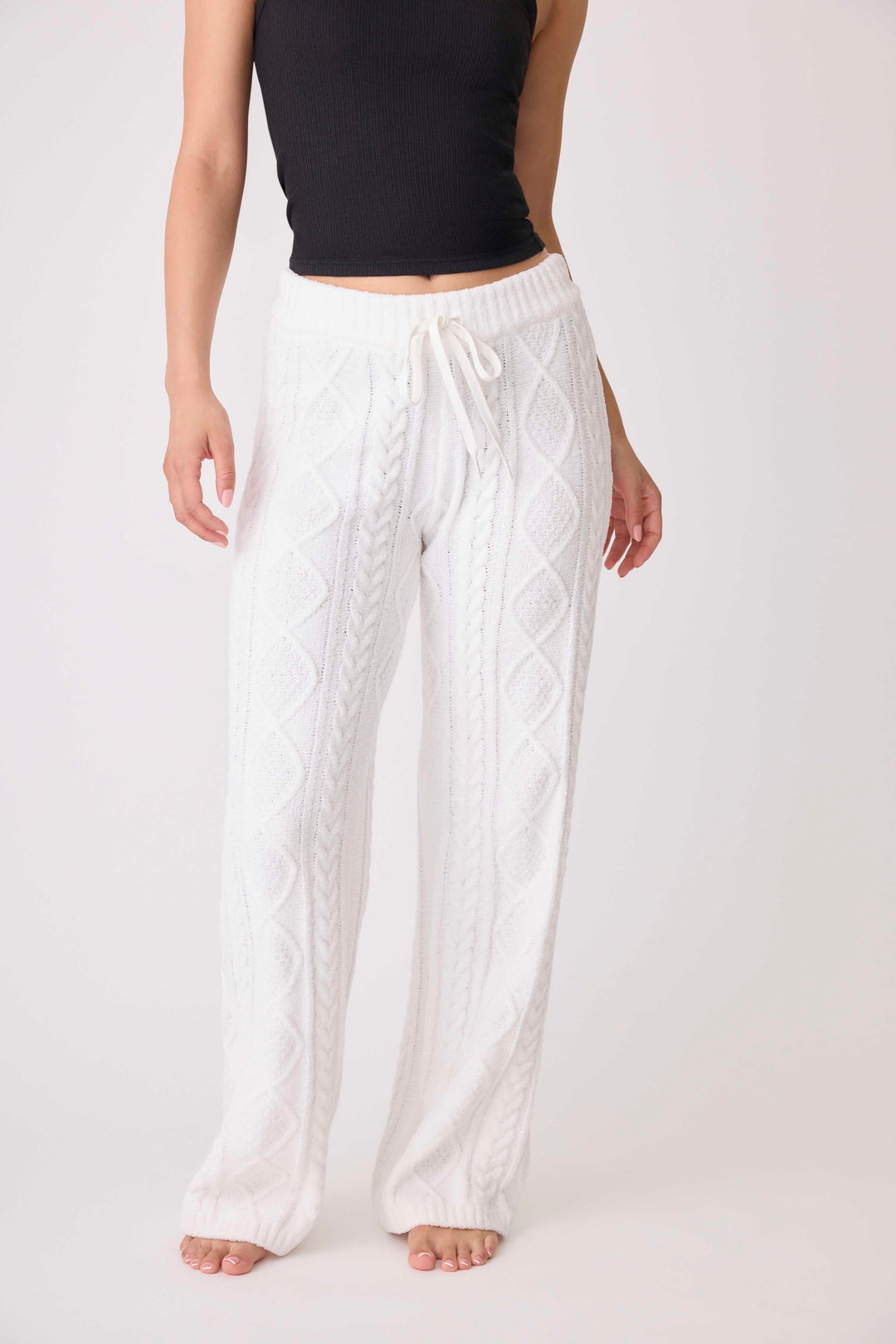 Women's cable texture sweater pant in ivory knit. Rib waistband, straight leg fit.