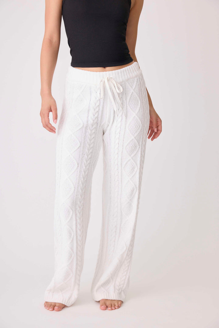 Women's cable texture sweater pant in ivory knit. Rib waistband, straight leg fit.