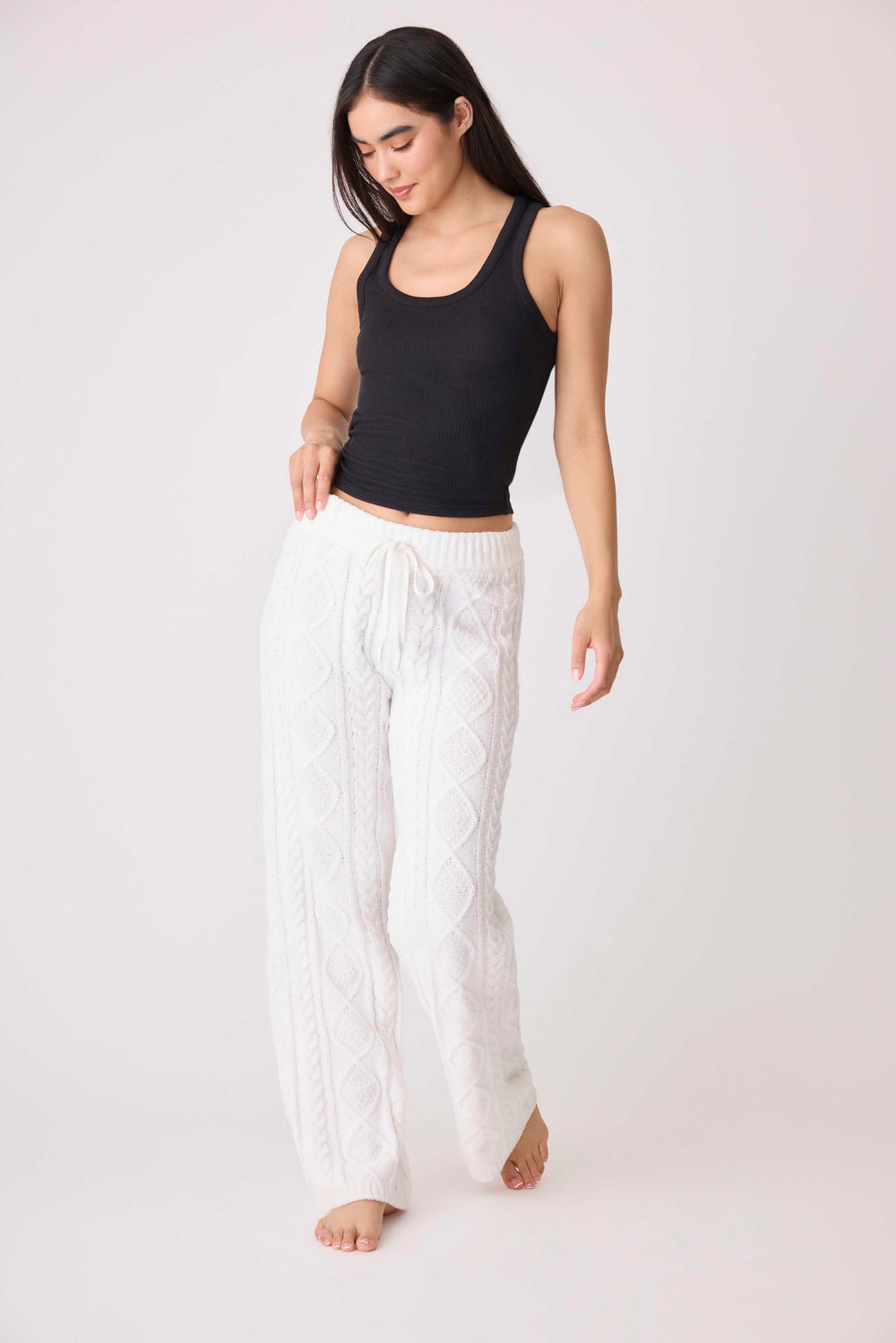 Women's cable texture sweater pant in ivory knit. Rib waistband, straight leg fit.