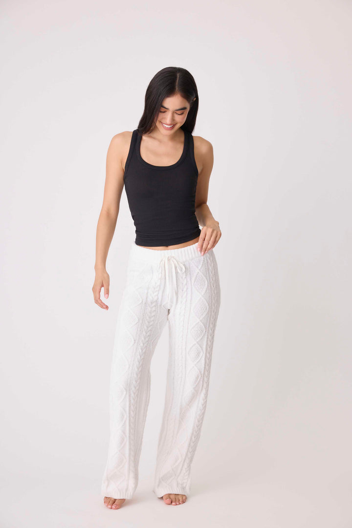 Women's cable texture sweater pant in ivory knit. Rib waistband, straight leg fit.