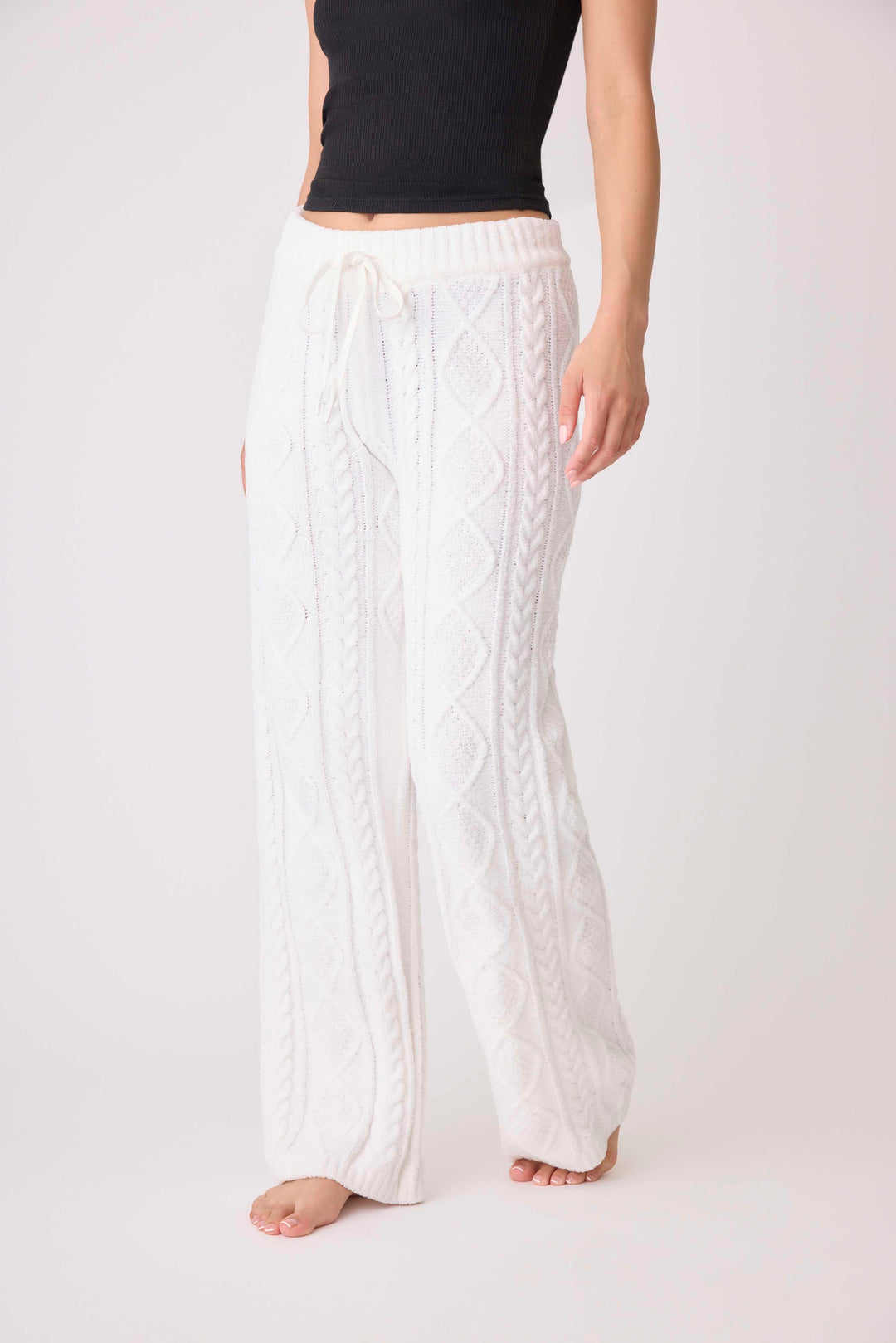 Women's cable texture sweater pant in ivory knit. Rib waistband, straight leg fit.