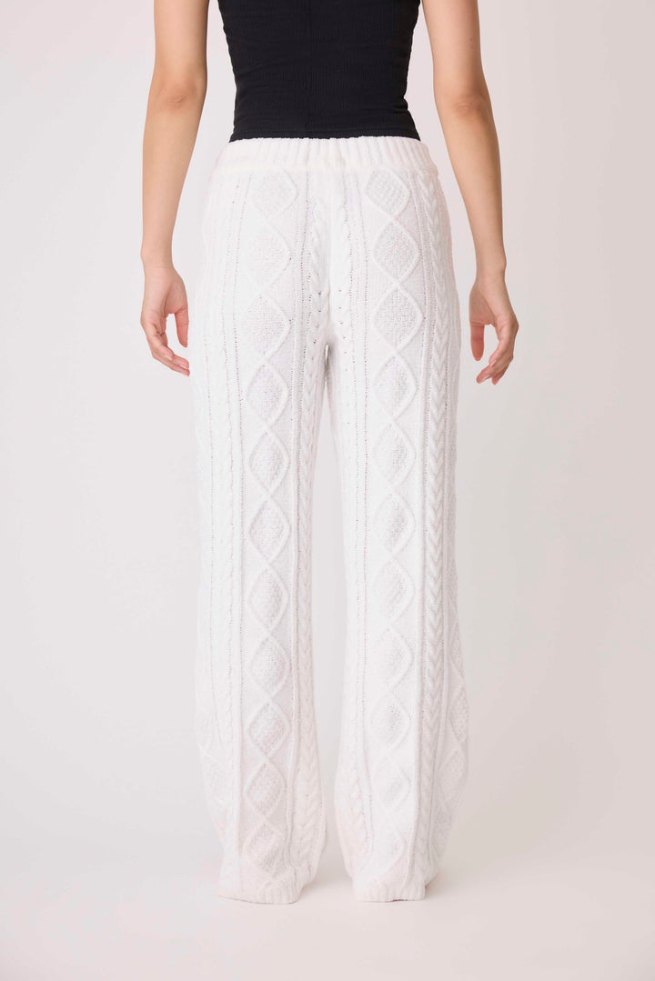 Women's cable texture sweater pant in ivory knit. Rib waistband, straight leg fit.