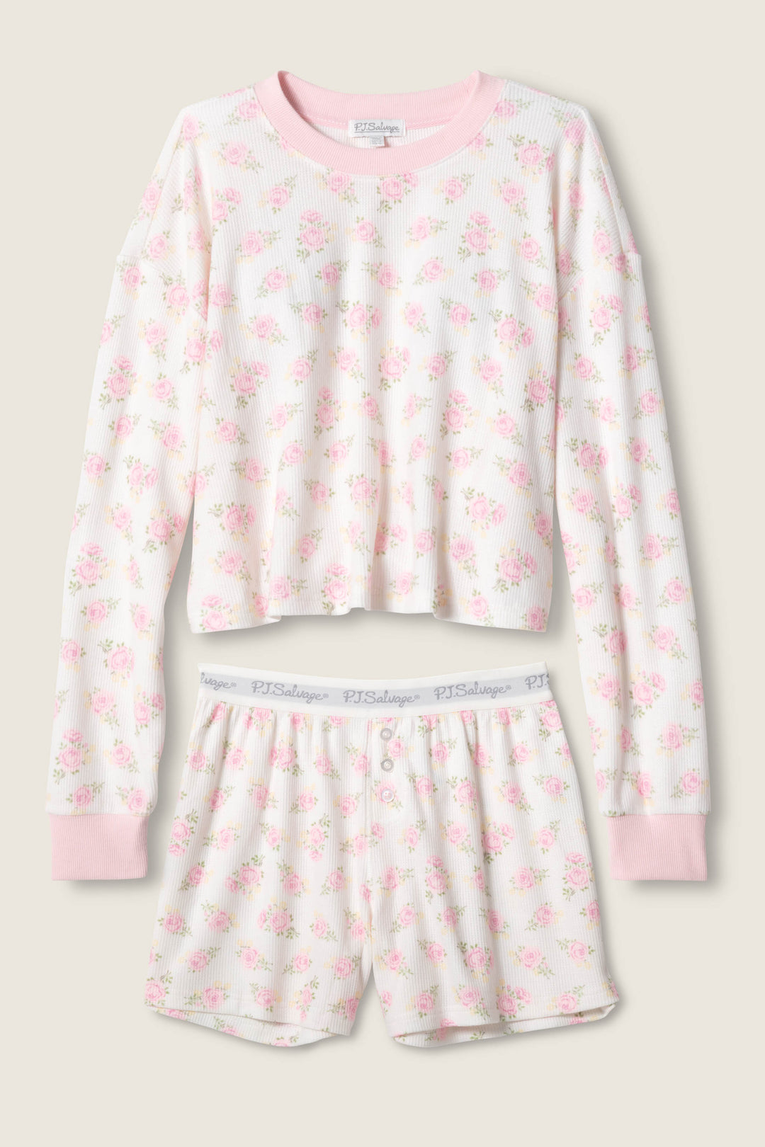 The Boyfriend Boxer Ditsy Floral Shorts Set by P.J. Salvage features a matching long-sleeve top with pink cuffs and floral print, paired with white button-front shorts with an elastic waistband and subtle P.J. Salvage branding.