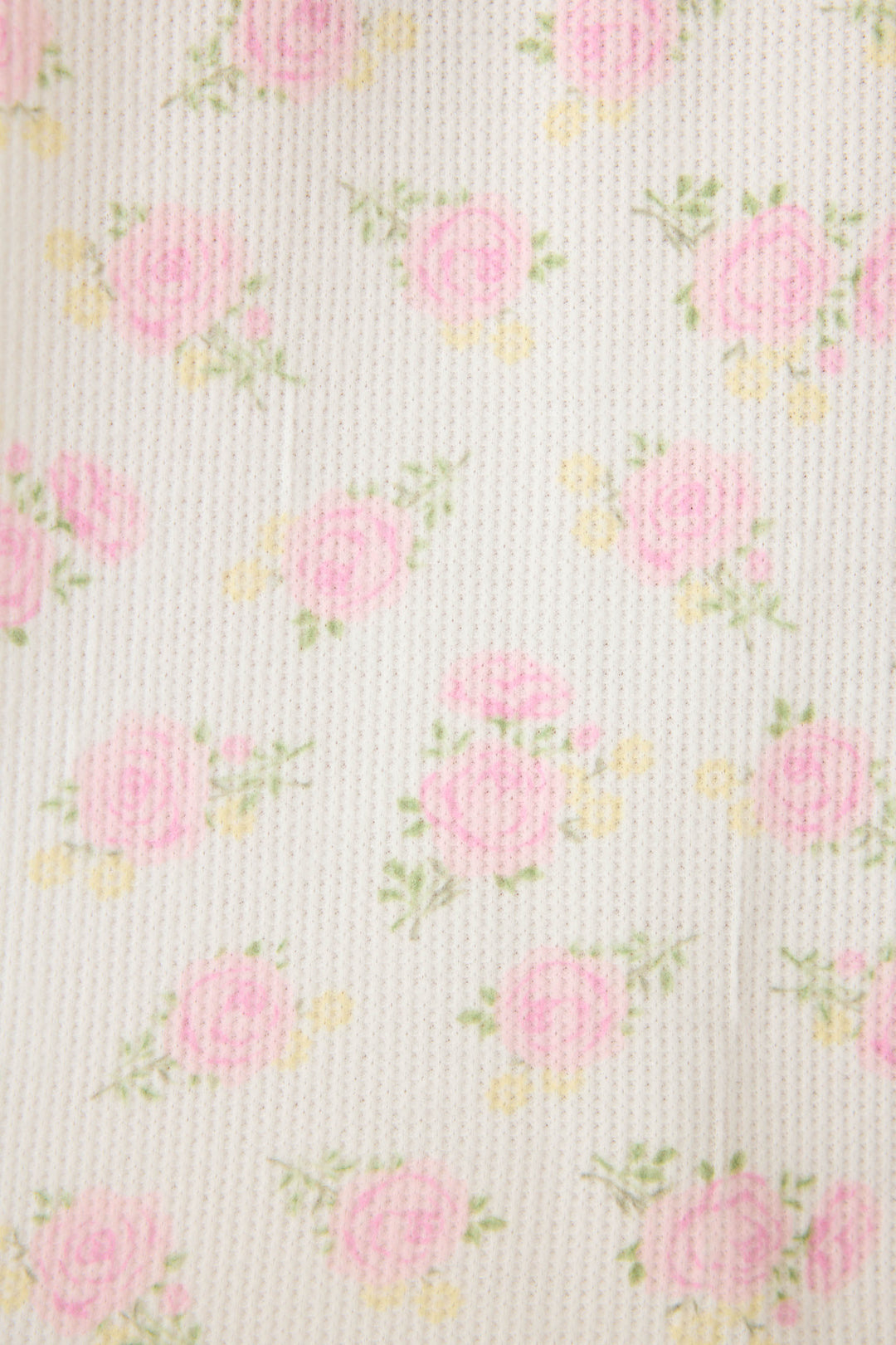 The P.J. Salvage Boyfriend Boxer Ditsy Floral Shorts Set features textured, ribbed fabric with a cream background and an allover pattern of small pink roses and green leaves.