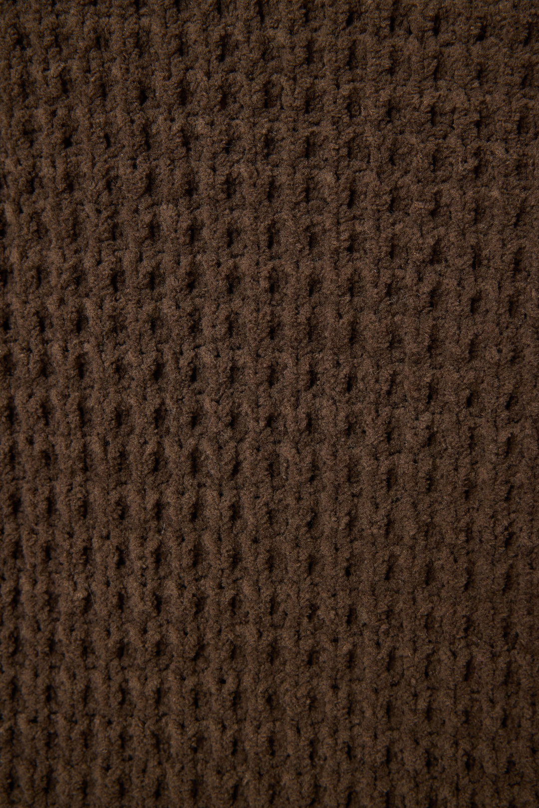Close-up of the P.J. Salvage Chenille Waffle Solid Chocolate Banded Pant, featuring brown textured fabric with a grid-like waffle pattern, vertical ridges, and a soft, fuzzy surface.