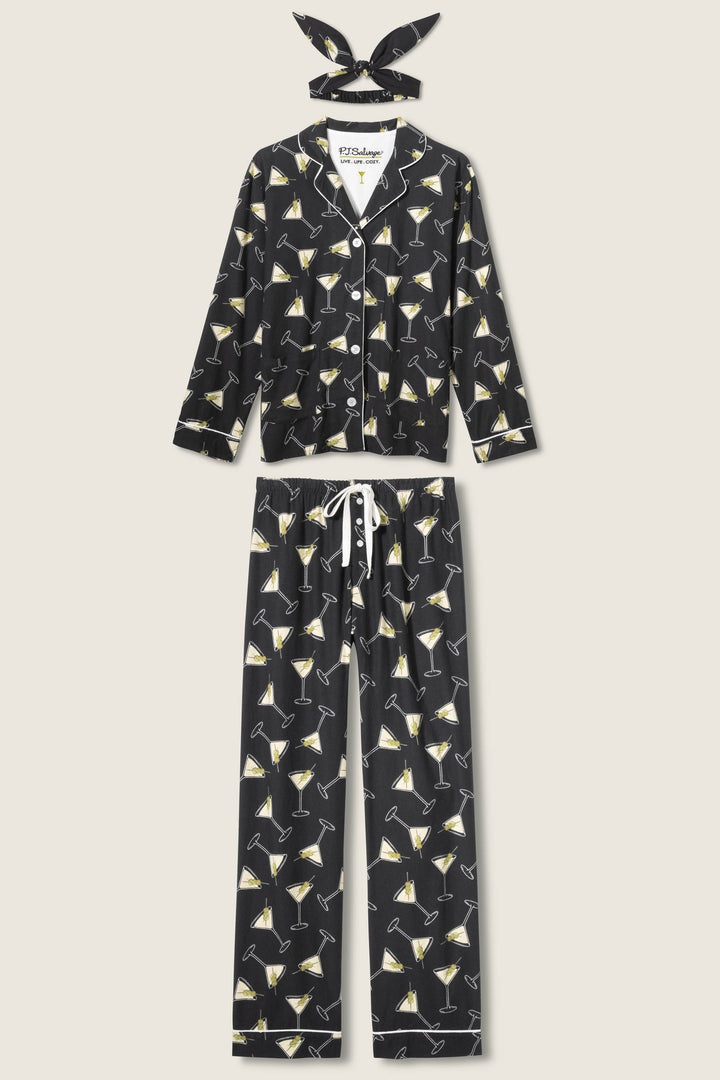 The P.J. Salvage Merrier With A Martini Flannel PJ Set includes a button-up long sleeve shirt, drawstring pants, and a headband—each black with a yellow-accented martini glass print.