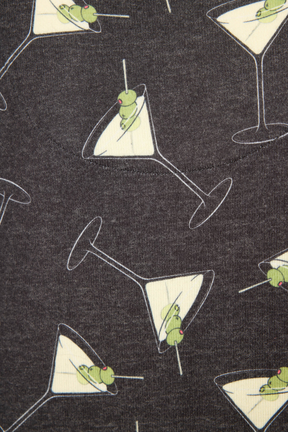 The P.J. Salvage Merrier With A Martini Banded Pant features a dark grey fabric printed with cartoon-style martini glasses and green olives on toothpicks, arranged in various directions.