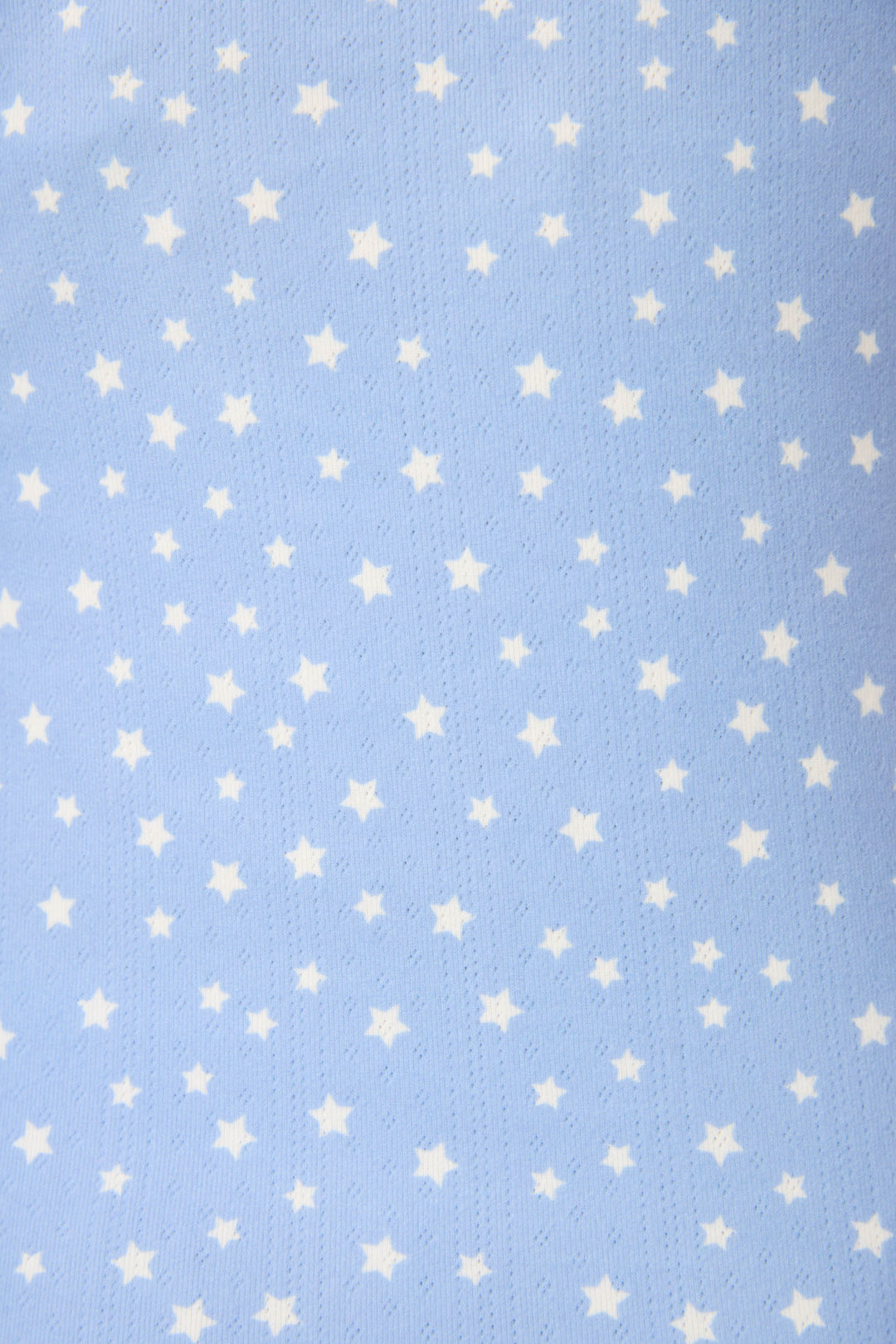 The Pointelle Essentials Ditsy Star 4-Piece Loungewear Set by P.J. Salvage features soft, light blue fabric with a subtle texture and a pattern of small, evenly spaced white stars.