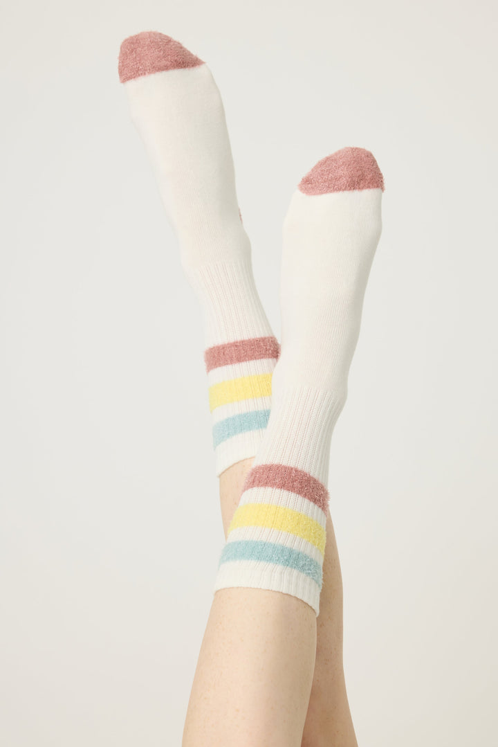 1-pack crew sock with feather yarn pastel stripes. Women & girls ivory sock with gripper soles.