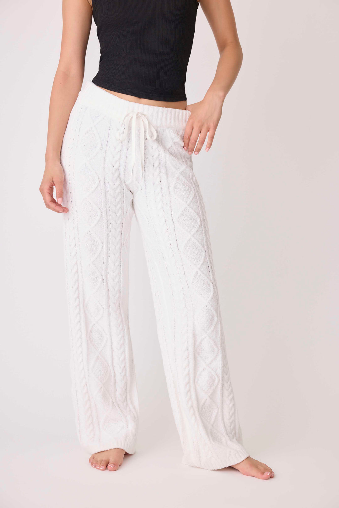 Women's cable texture sweater pant in ivory knit. Rib waistband, straight leg fit.