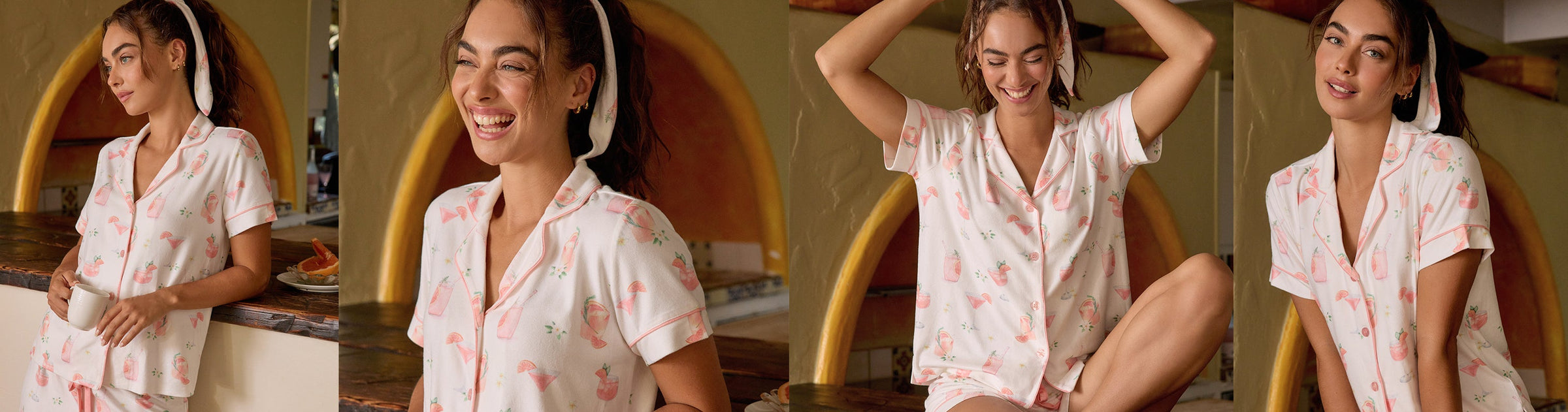 Three women in pajamas pose playfully in front of a sky-blue background with clouds. Two wear blue pajamas, one wears a white floral set; they are laughing and holding hands, appearing to gently pull each other.