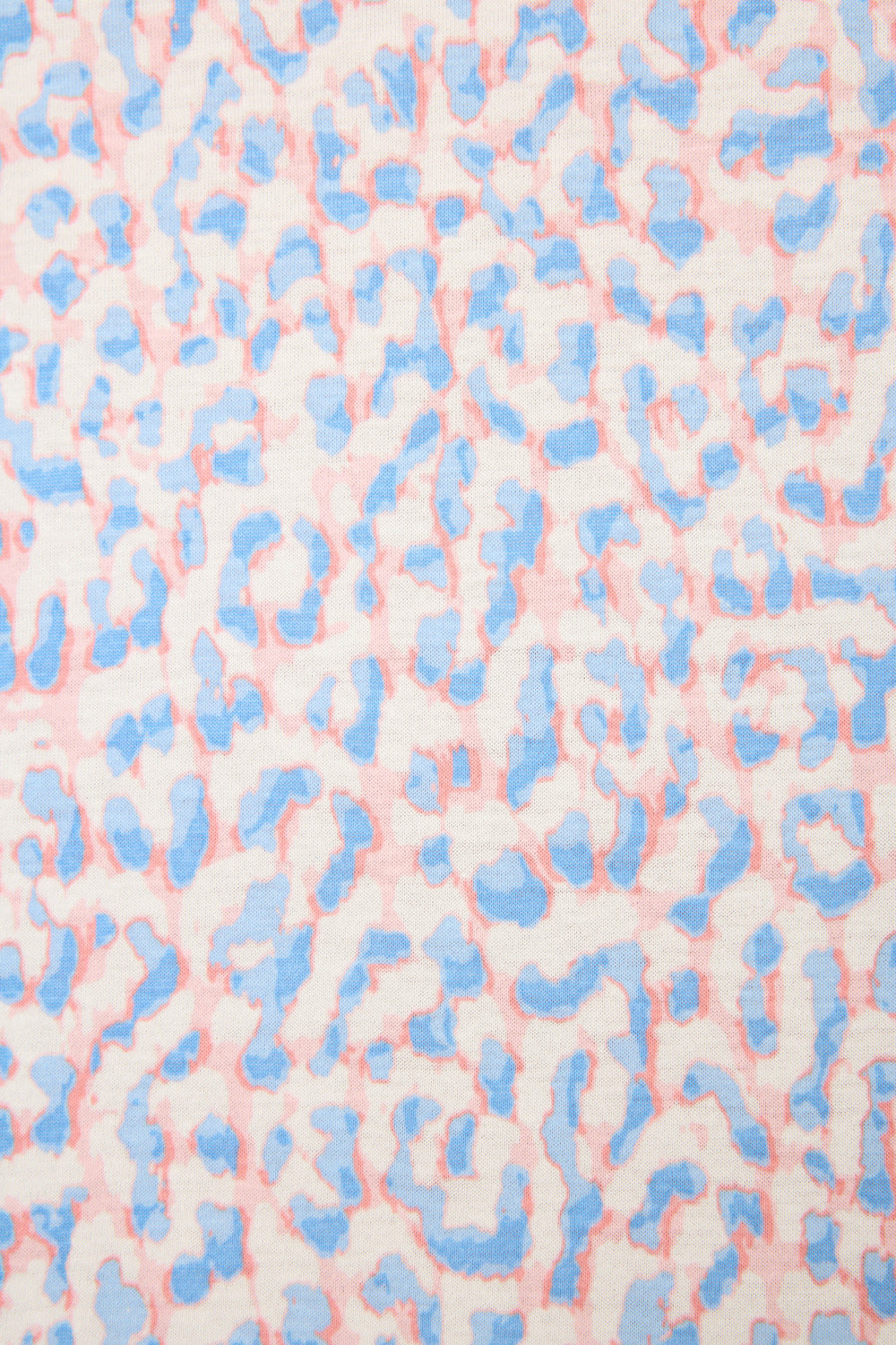 A close-up of the Animal Lover Leopard Print 3-Piece Shorts Set by P.J. Salvage shows a soft-edged, abstract leopard pattern in pastel blue and pink on white, creating a subtle animal print effect.