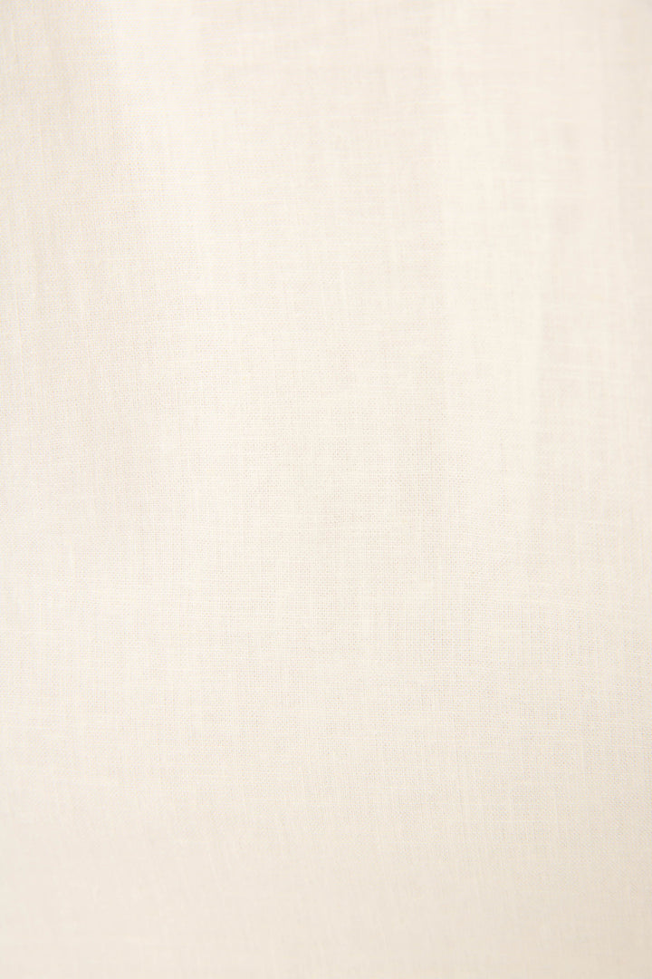Light beige fabric with a subtle visible weave and smooth texture.