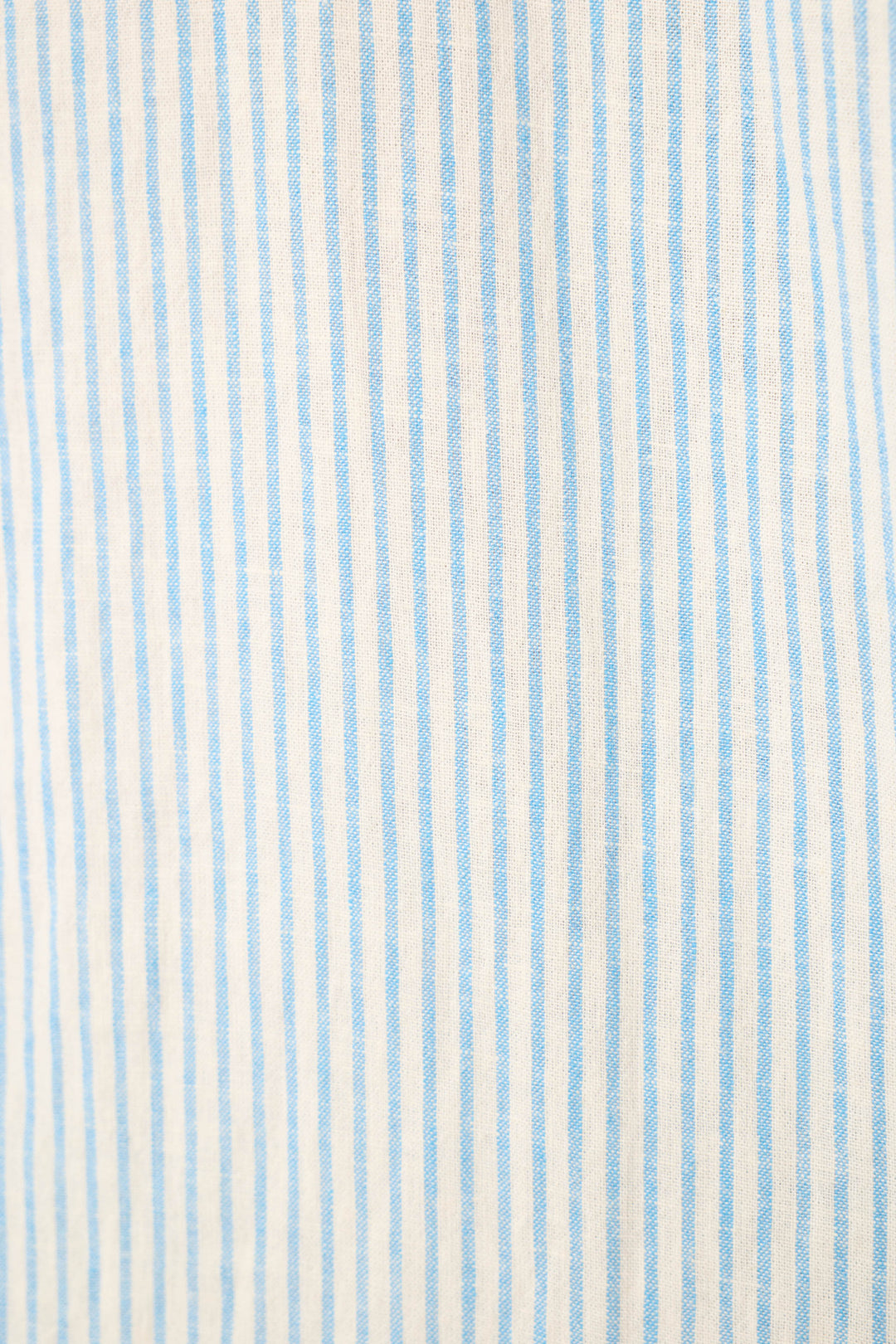 Lightweight fabric with vertical light blue and white pinstripes and a subtle, textured feel.