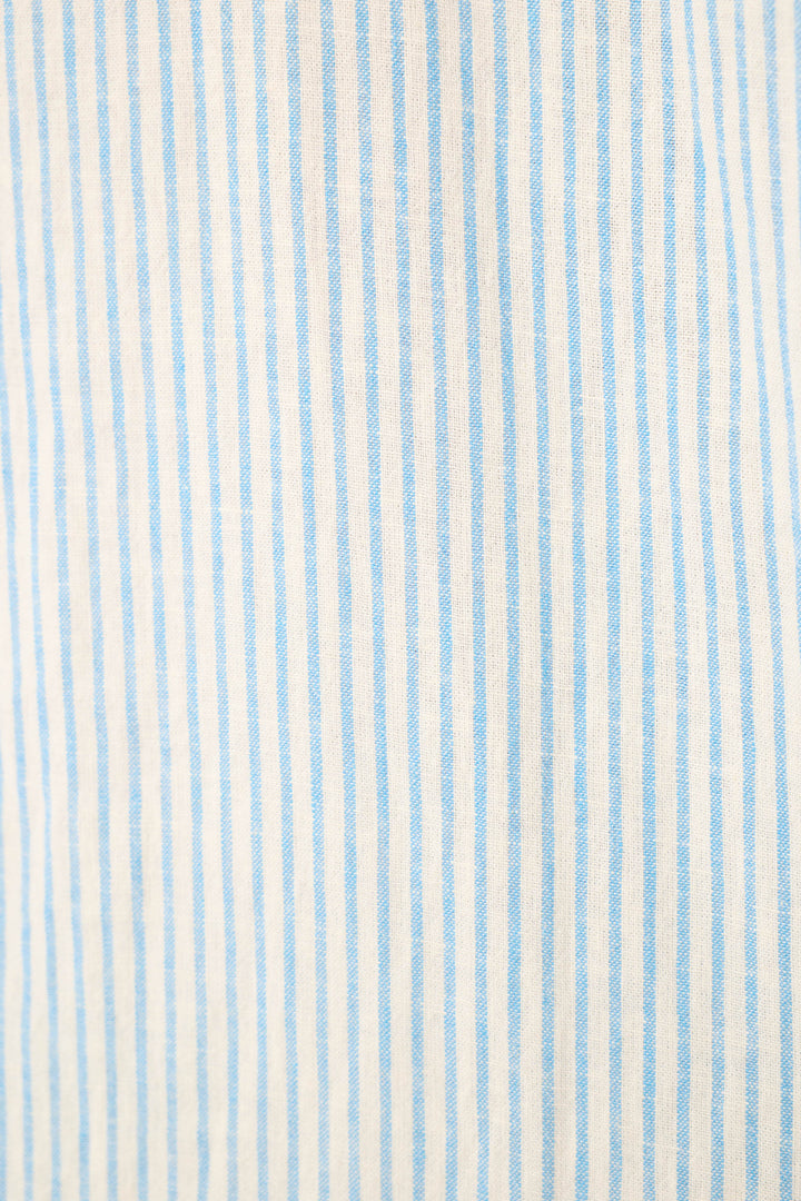 Lightweight fabric with vertical light blue and white pinstripes and a subtle, textured feel.