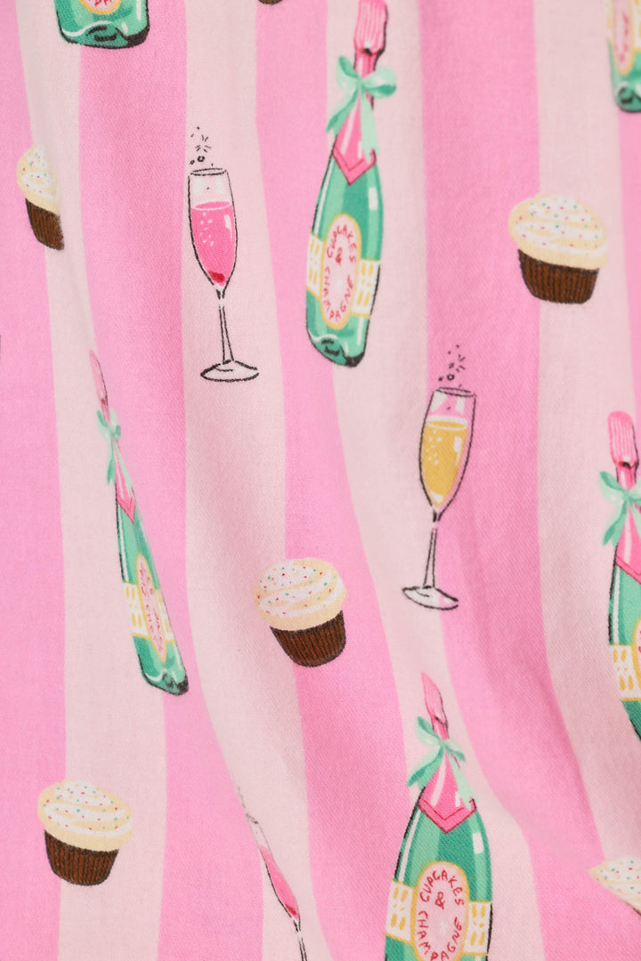 Pink striped fabric with a repeating pattern of champagne bottles, champagne glasses, and cupcakes.