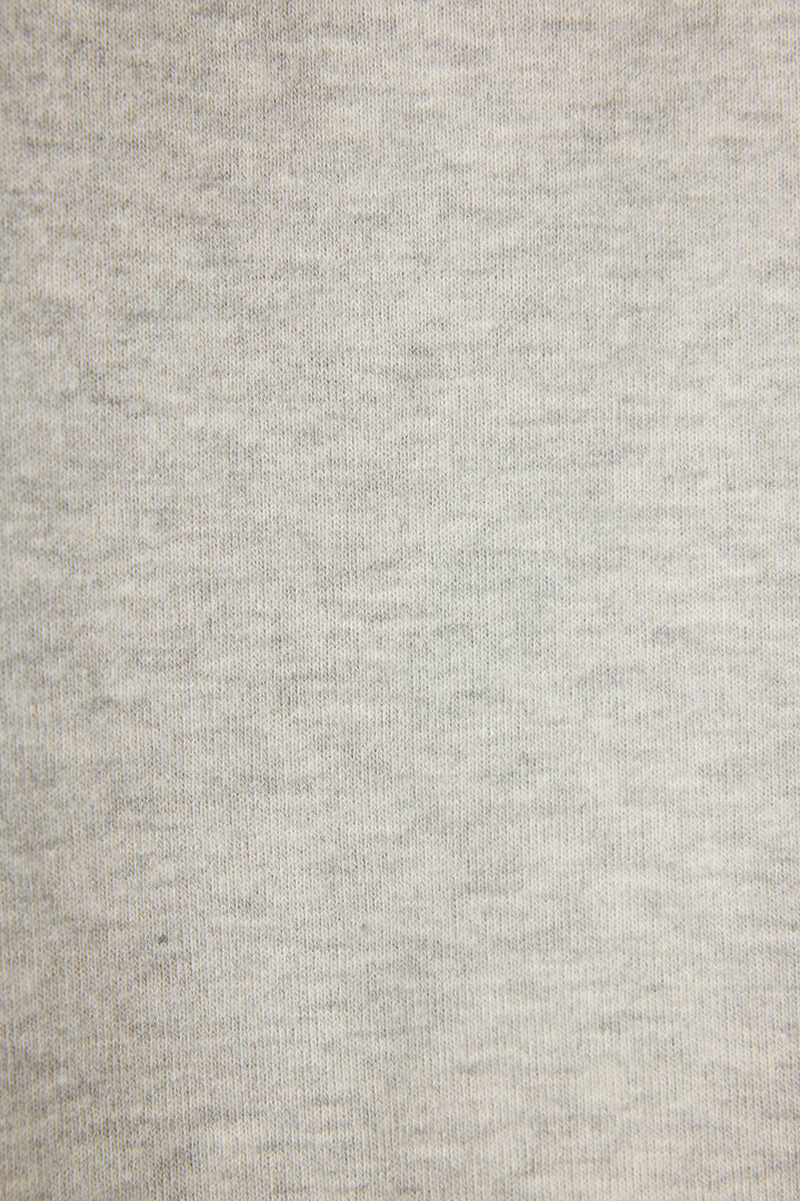 Close-up of the C'est La Vie Heather Grey Hoodie by P.J. Salvage, featuring light gray fabric with a soft, evenly woven heathered texture and subtle tone variations across the surface.