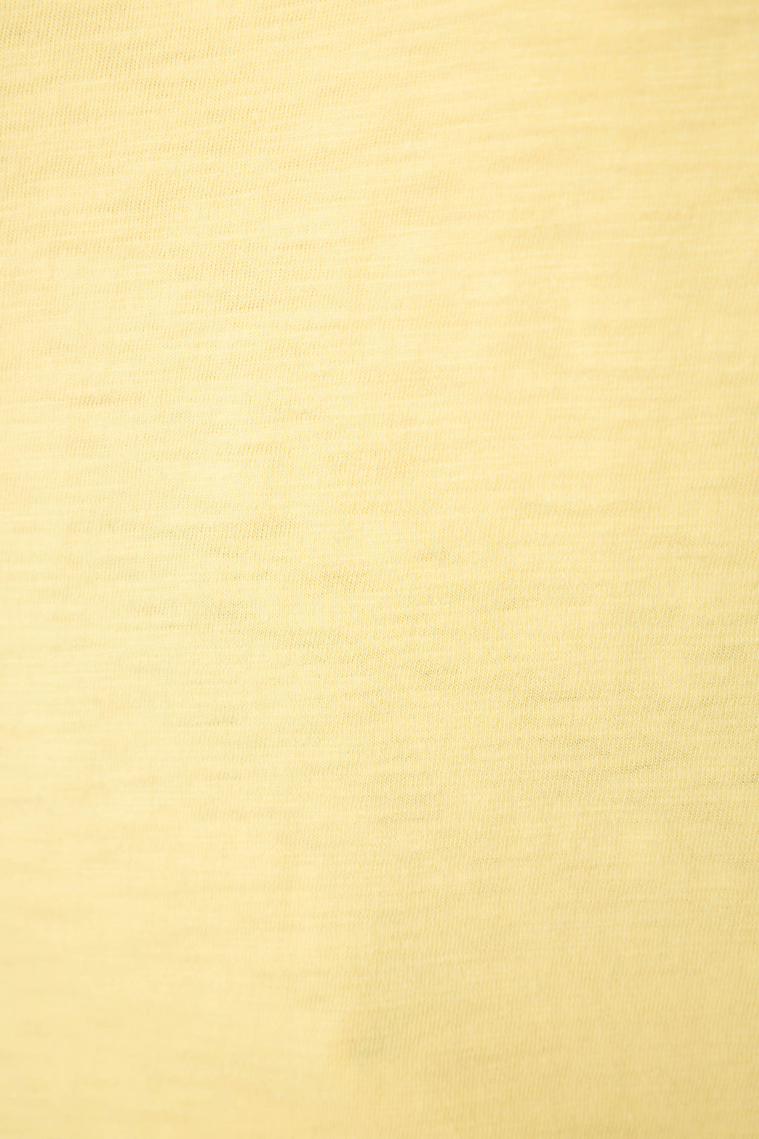 Light yellow fabric with a subtle horizontal texture, soft feel, even color, and faint weave lines visible.