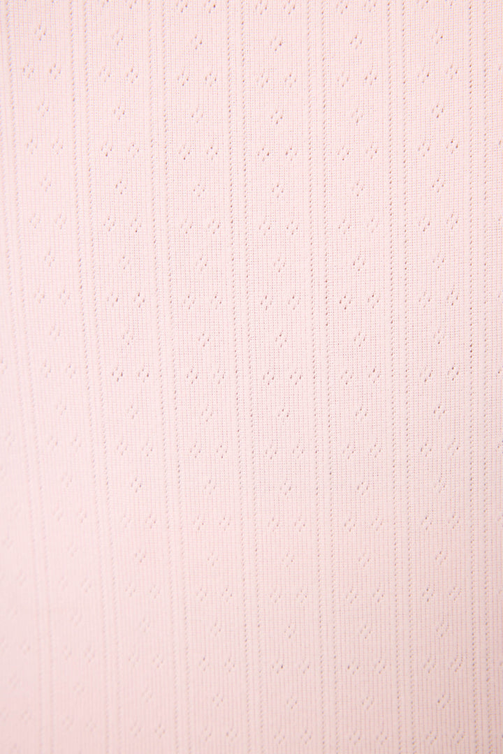 Close-up of Luxe Leopard Dreams Ballet Pink Shorts by P.J. Salvage, featuring pale pink ribbed fabric with subtle dotted perforations—ideal for breathable, feminine sleepwear or loungewear.