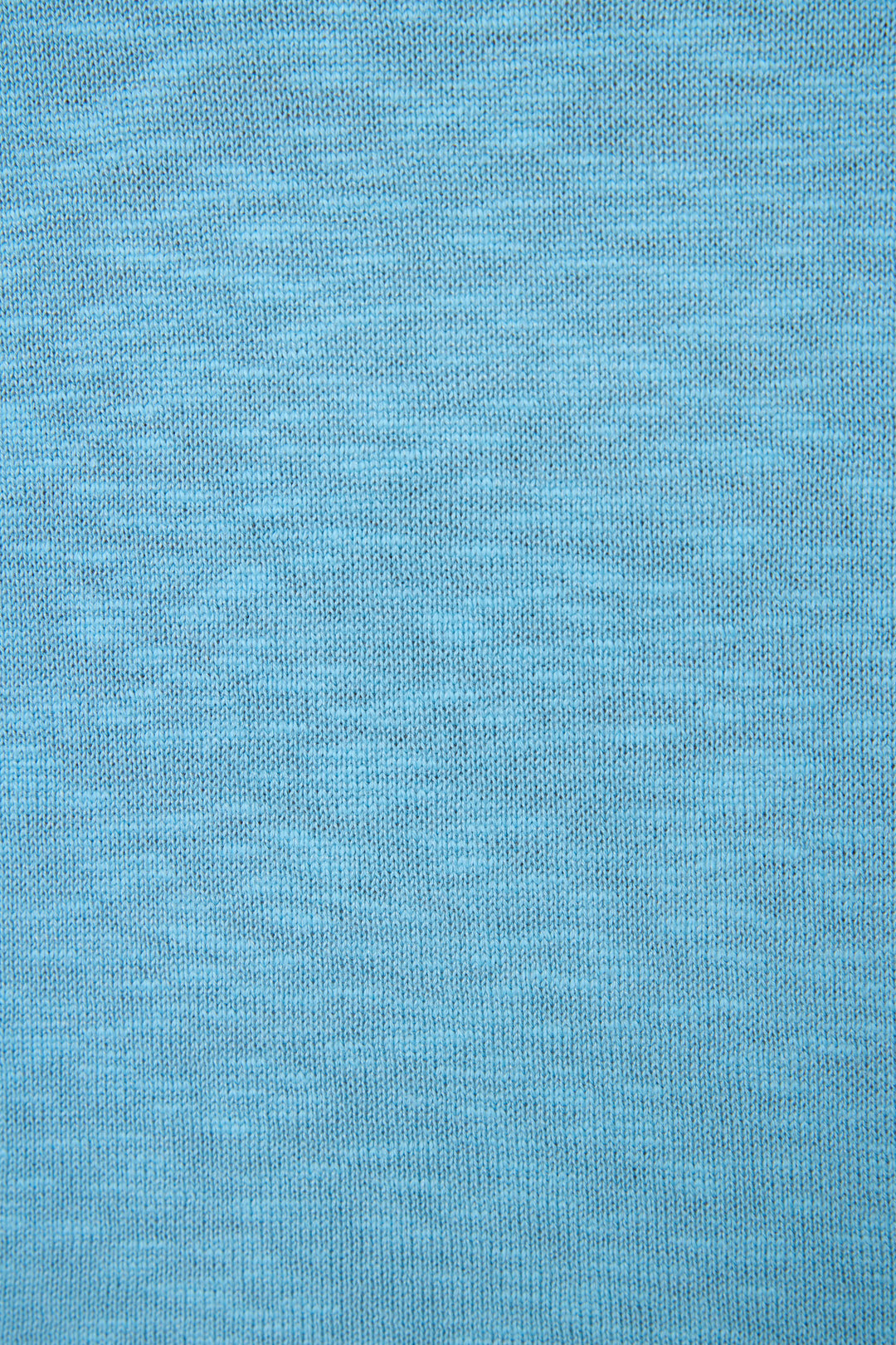 Light blue fabric with a fine, even knit texture and a smooth, uniform surface without visible markings or designs.