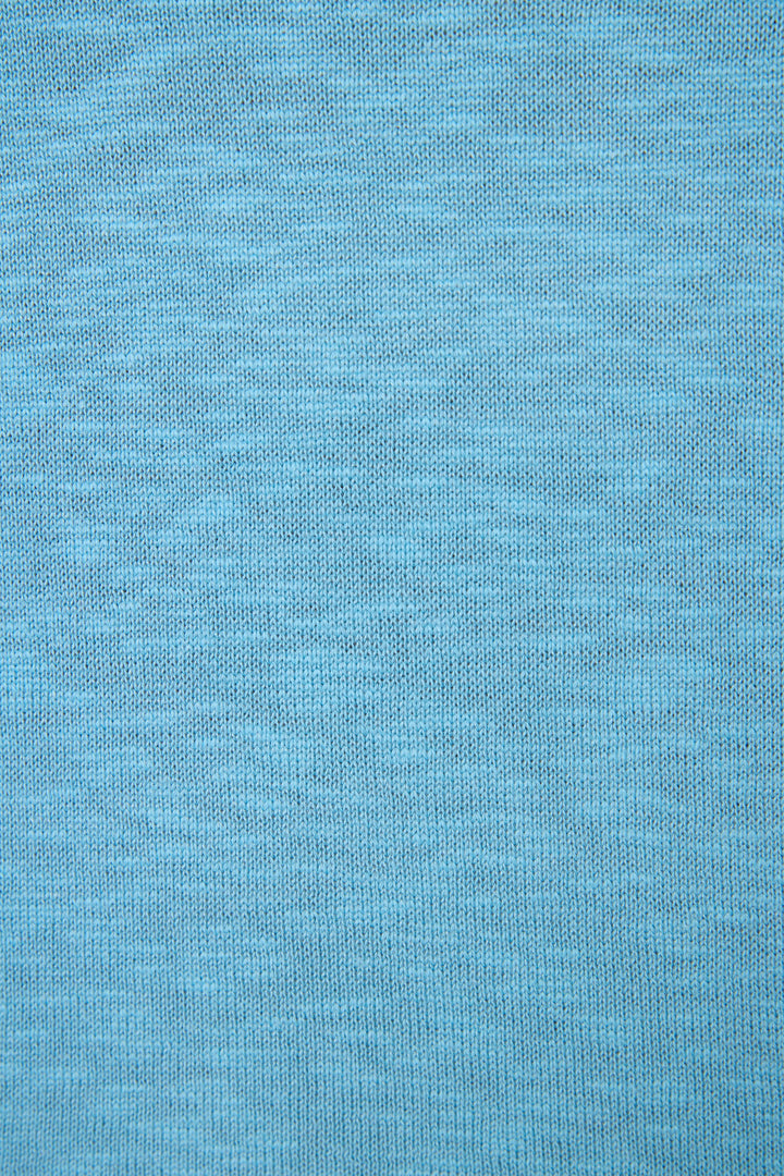 Light blue fabric with a fine, even knit texture and a smooth, uniform surface without visible markings or designs.