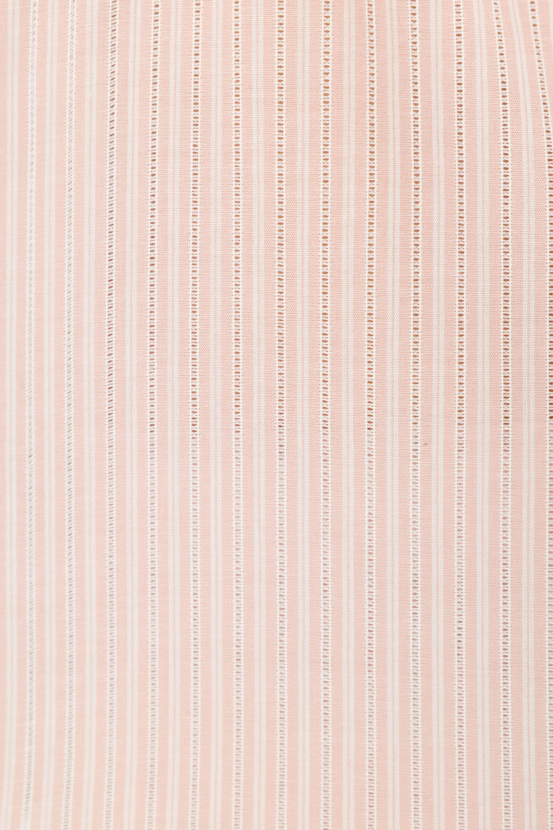 Close-up of the P.J. Salvage On Cloud Nine Silver Rose Short Sleeve Pajama Top, featuring light pink fabric with evenly spaced vertical white stripes—smooth, slightly sheer, and perfect for women's sleepwear.