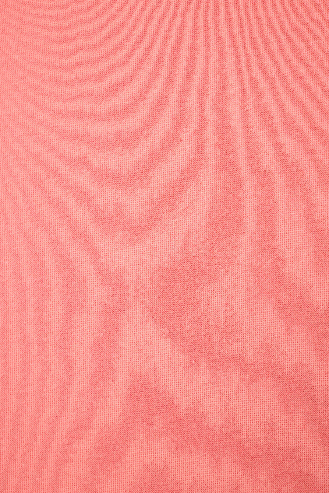 A close-up of the Paloma Mama Cocktails Please Graphic Sweatshirt by P.J. Salvage shows its sunset rose fabric with a smooth, fine knit texture and an even, uniform finish without visible patterns or irregularities.