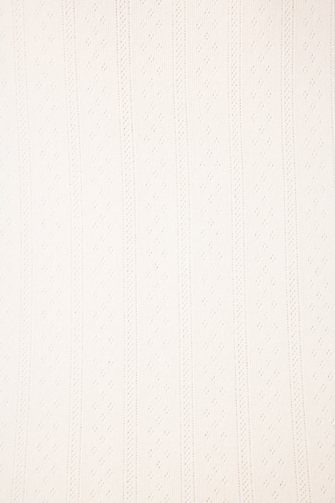 A close-up of the Pointelle Essentials Ivory Cardigan by P.J. Salvage shows its uniform, subtly raised vertical stripes and dotted texture in light beige fabric.