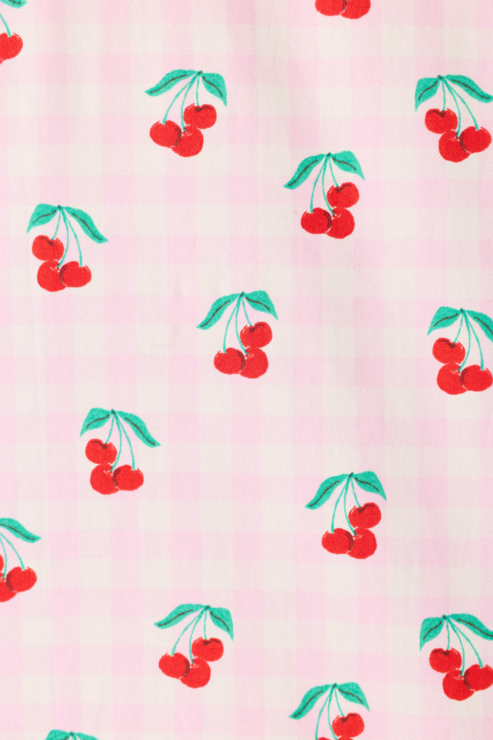 The Afterparty Poplin Oh Cherry Short PJ Set by P.J. Salvage features a playful red cherry print with green leaves on a light pink and white checkered cotton poplin, offering a charming and fresh sleepwear choice.