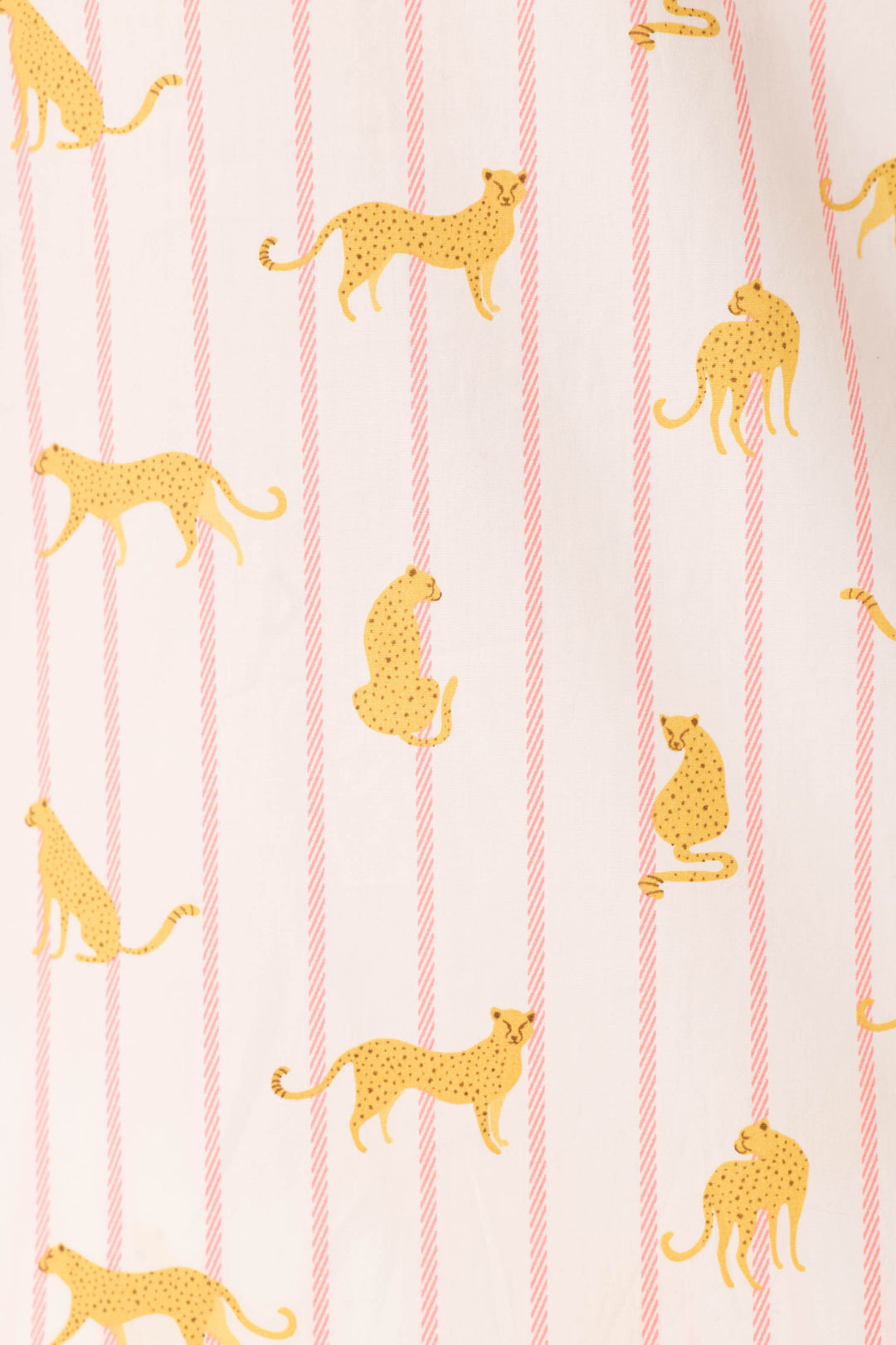 The Afterparty Poplin Cheetah Charm Short PJ Set by P.J. Salvage features white cotton with playful yellow cheetahs layered over diagonal sunset rose stripes—a fun twist on classic pink cheetah print pajamas.
