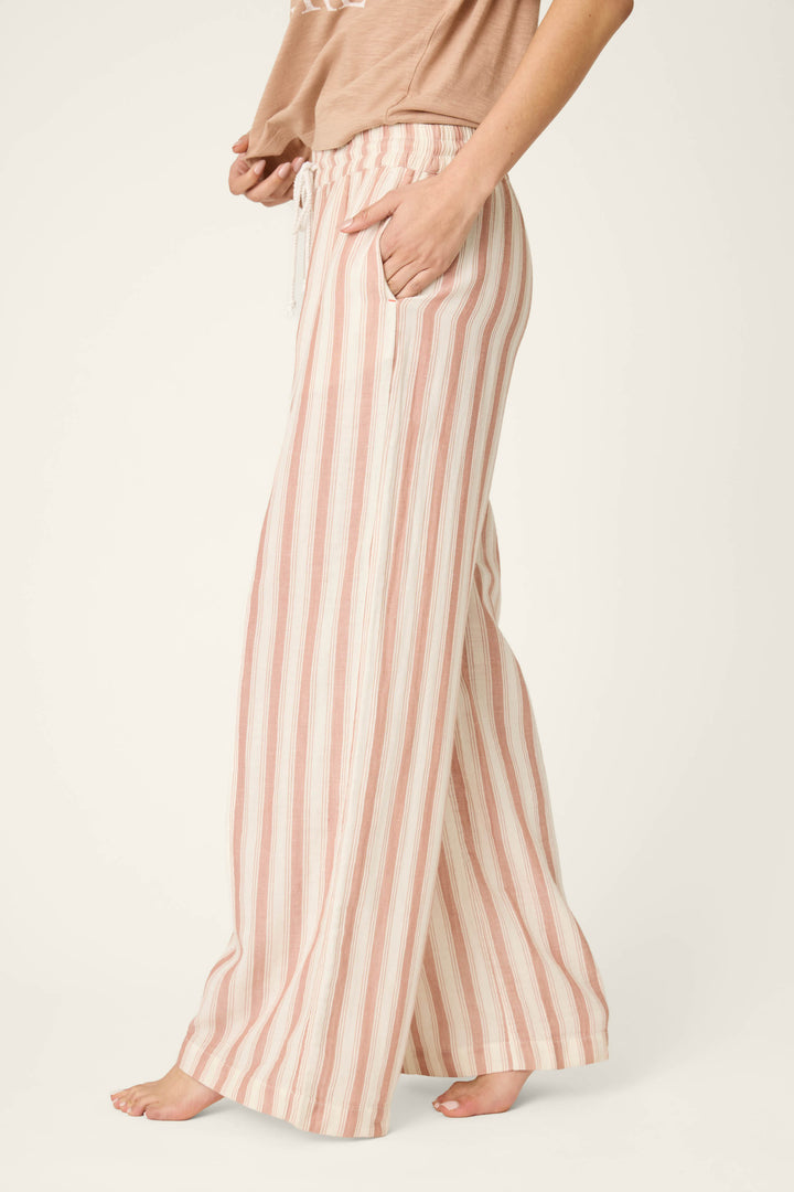 Vertical stripes in beige, white, and pink on a loose, soft fabric; smooth texture with visible drawstring ties.