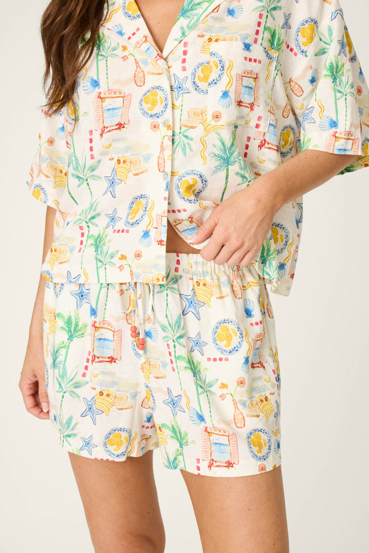 Colorful, tropical print featuring vibrant patterns and hues, with a smooth fabric texture.