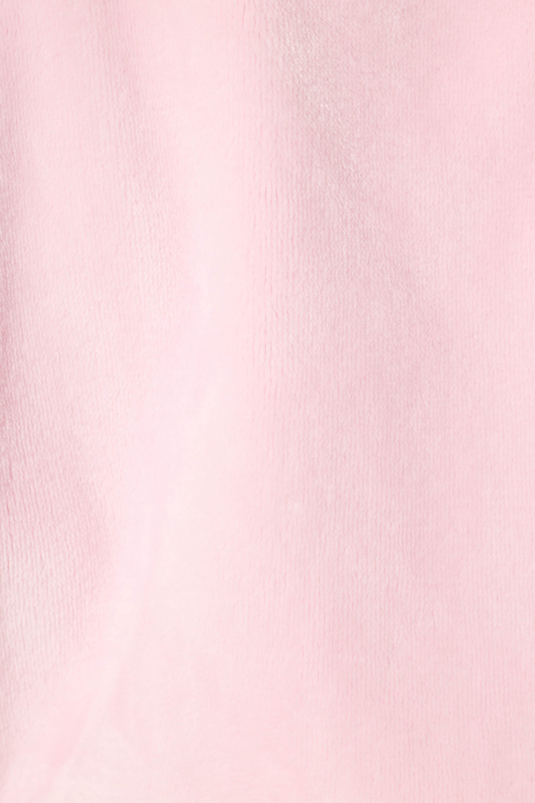 A close-up of the Luxe Plush Solid Pink Robe by P.J. Salvage showcases its soft, light pink fabric with a slightly fuzzy texture and subtle shading, reminiscent of plush fleece.