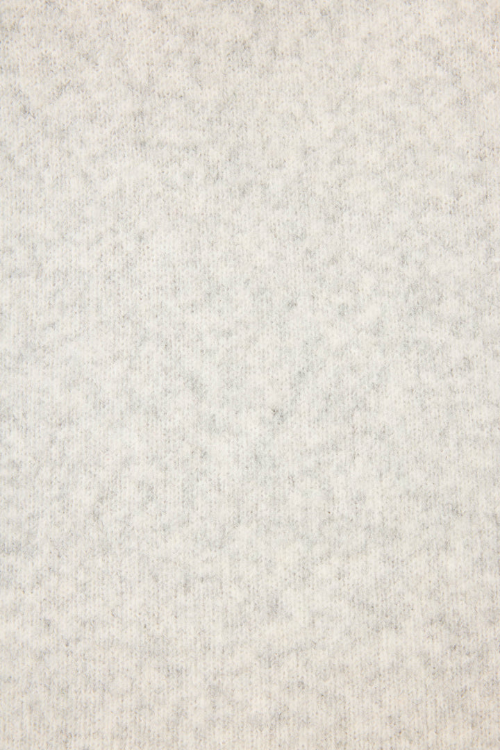 Close-up of the Pretty Punch Happy Hour Snuggle Sweater by P.J. Salvage, showing its light gray, soft-textured fabric with a subtle, even pattern for a cozy, uniform look.