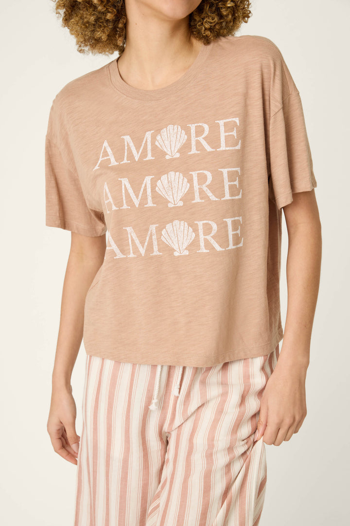 Light brown fabric with repeated "AMORE" text and seashell graphics, paired with pink and white striped material.