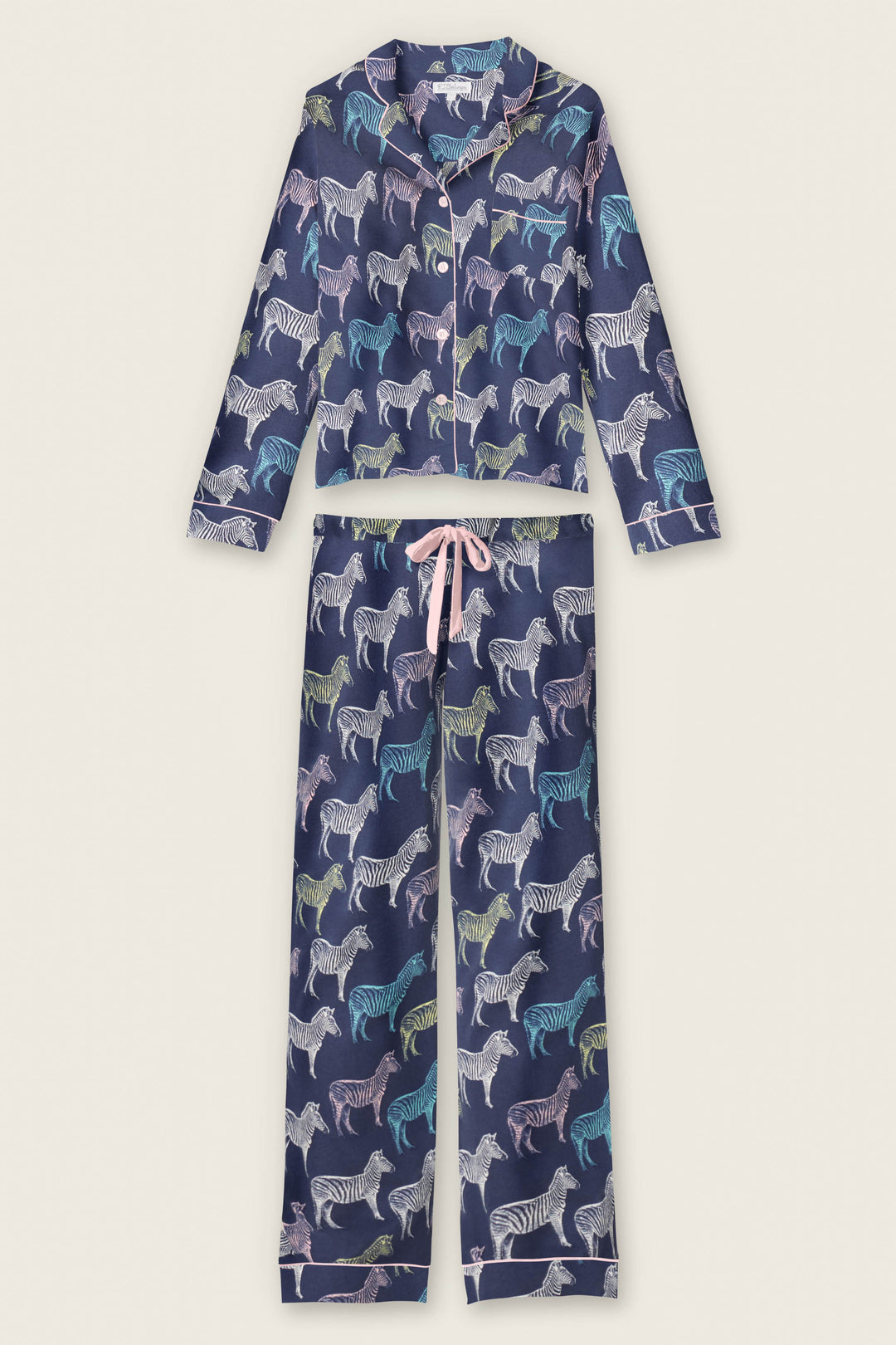 The Whimsy Technicolor Safari PJ Set by P.J. Salvage features a navy blue long-sleeve button-up top and pants, both decorated with a colorful zebra print and finished with a pink drawstring waist.