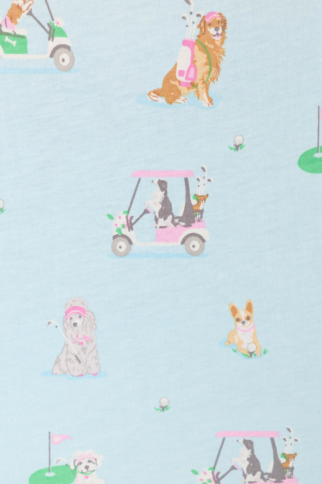 The Whimsy Putter Pup Cropped PJ Set by P.J. Salvage features playful dogs golfing among golf carts, clubs, and course details on a light blue fabric.
