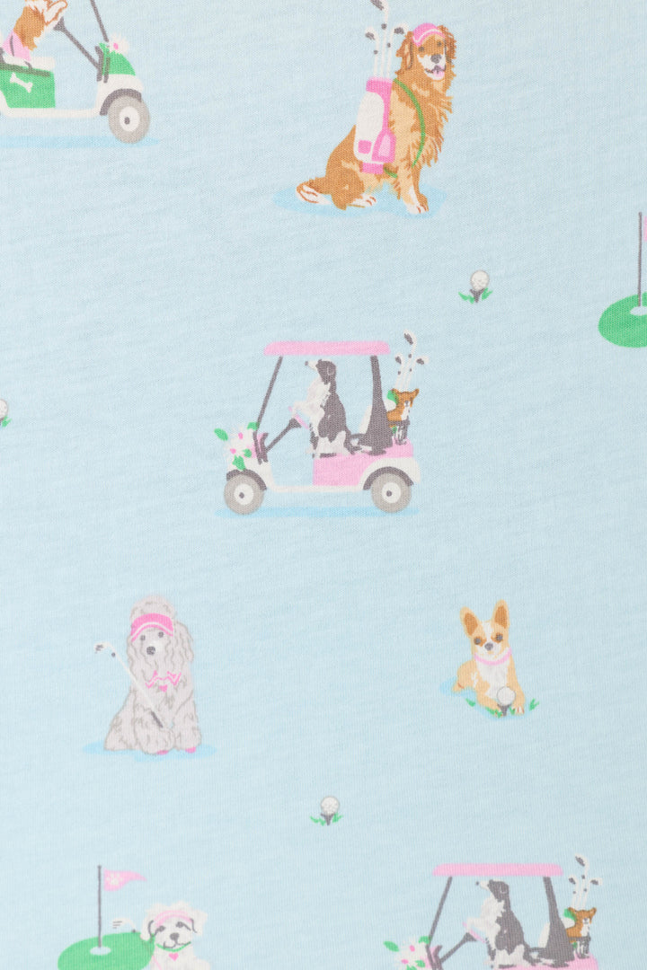 The Whimsy Putter Pup Cropped PJ Set by P.J. Salvage features playful dogs golfing among golf carts, clubs, and course details on a light blue fabric.