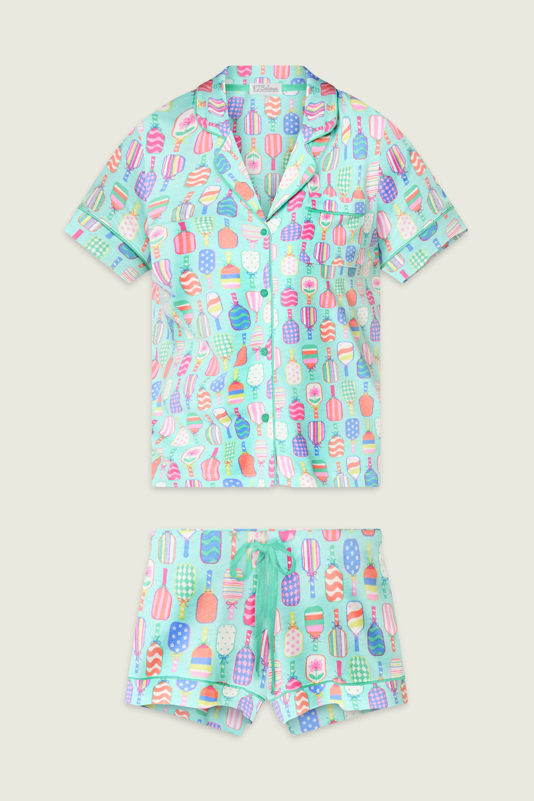 The Whimsy Paddle Party Short PJ Set by P.J. Salvage features a short-sleeved button-up shirt and matching shorts with a colorful ice cream and popsicle print on a light background, displayed flat on an off-white surface.