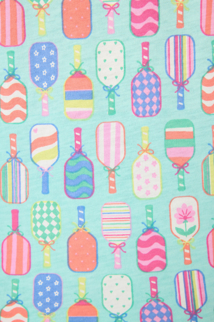 The Whimsy Paddle Party Short PJ Set by P.J. Salvage features a playful print of colorful pickleball paddles with stripes, polka dots, stars, and hearts on a light blue background.