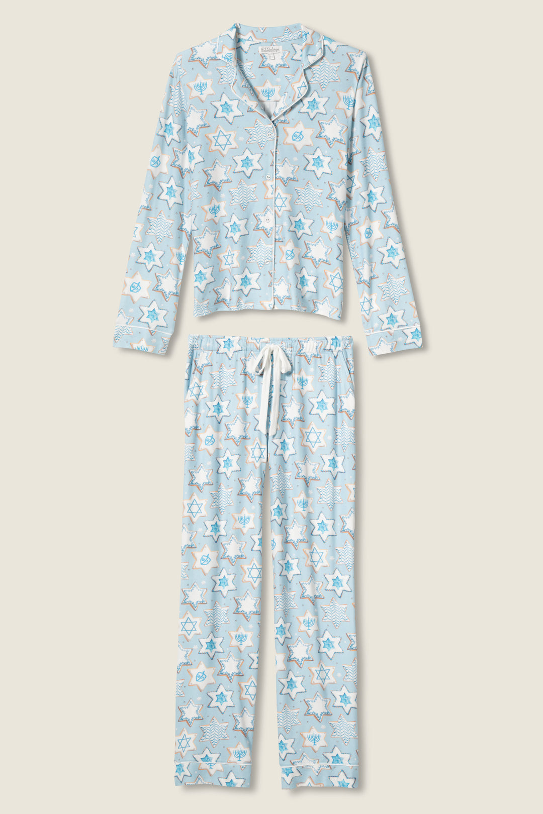 The HANUKKAH PJ SET YOU HAD ME AT SHALOM by P.J. Salvage is a two-piece pajama set with a button-up long-sleeve top and drawstring pants, featuring a light blue and white Star of David pattern.