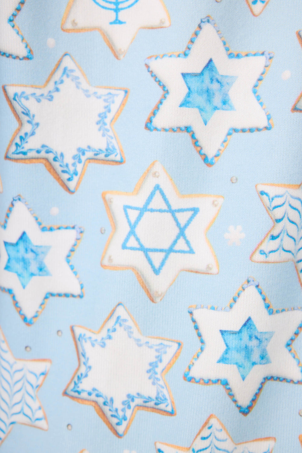 The HANUKKAH PJ SET YOU HAD ME AT SHALOM by P.J. Salvage features a festive pattern of blue and white Hanukkah star-shaped cookies, some with the Star of David, set on a light blue background.