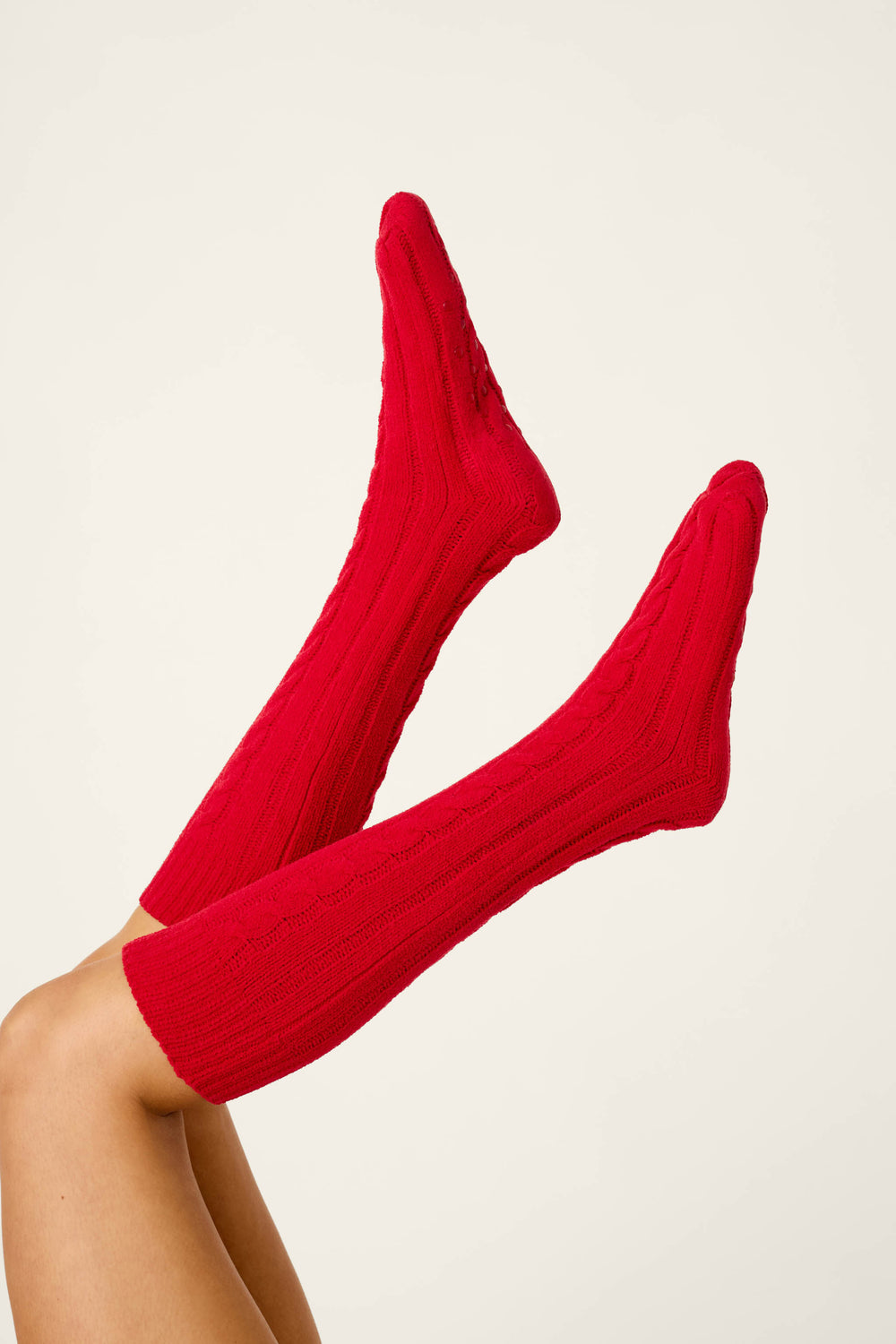 P.J. Salvage Cozy Chenille Cable Knit Red Socks worn on legs held in the air.