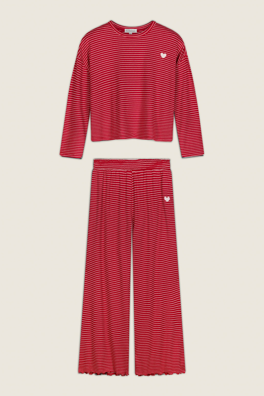 Icon Stripes Red Long Sleeve PJ Set featuring a red, long-sleeve top and wide-leg pants with thin white horizontal stripes, accented by a small white heart embroidered on the chest and hip.